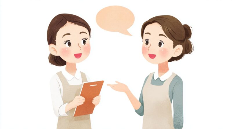 介護現場で女性職員同士が笑顔でコミュニケーションを取っているイラスト